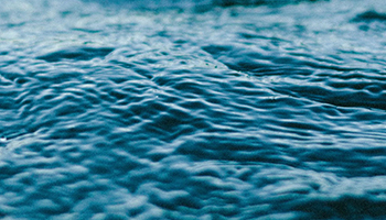 image of water with triangle play button